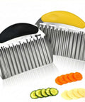 Two-piece stainless steel crinkle chopper and fry cutter with black and yellow handles; carrot, cucumber, potato slices.