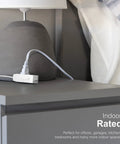 Heavy Duty Three Outlet Flat Extension Cord 3 Feet Long Grounded Power Cable With Secure Three Prong Plugs For Home Office Setup and Sleek Under Desk Layout near a lamp on a nightstand.
