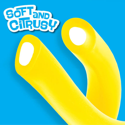Close-up of bright yellow Lemon Candy Ropes Soft And Chewy With Tart Citrusy Lemon Flavor on blue background.