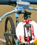 2 In 1 Bicycle Hydraulic Brake Hose Tool With Needle Driver And Hose Cutter in action, showing installation on bike handlebar.