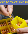 Person holding Heavy Duty Copper Battery Cable Ends Kit lug near yellow container, showing ring terminal connectors.
