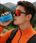 Man sipping from Foldable Water Bottle 200ml Shatterproof, Lightweight Hydration Bottle for Running, Travel and Adventure in mountains.