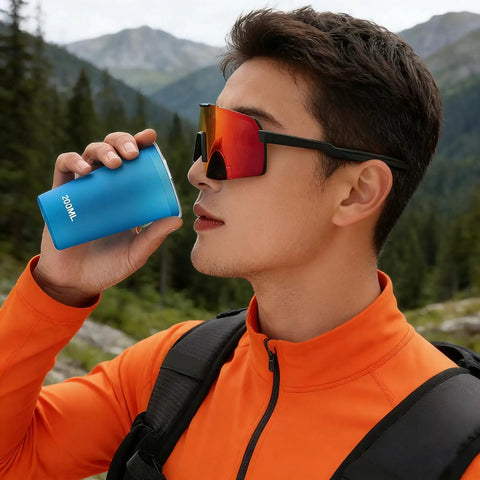 Man sipping from Foldable Water Bottle 200ml Shatterproof, Lightweight Hydration Bottle for Running, Travel and Adventure in mountains.