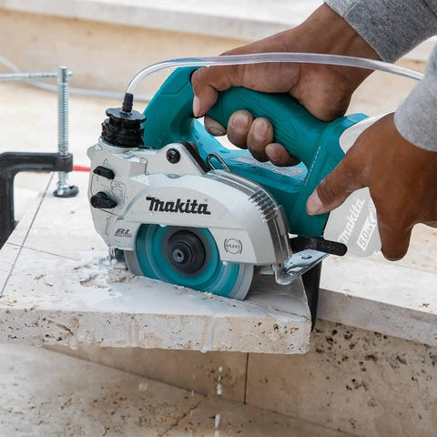 Worker using 18V Cordless Wet and Dry Masonry Saw With Beefed-Up Brushless Motor, AWS Capable, 5-Inch Cutting, Tool Only, on tile.