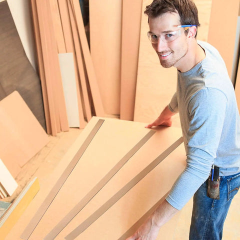 Worker handling 200 Piece Heavy Duty Cardboard Drywall Shims For Straightening Wavy Studs And Lifting Baseboards No Sweat Butt Joint Tuck Rock Solid Kraft Board.