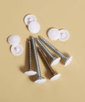 150 Pieces White Waterproof Self Tapping Screw Cap Covers, 12mm diameter, with screws on beige background