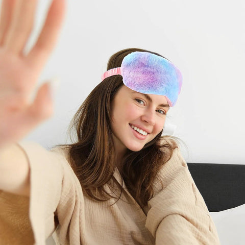 Woman wearing a Two Pack Plush Sleep Eye Masks Set, Ultra Soft Faux Fur Blindfold For Travel And Power Naps, colorful design, smiling.