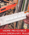 Hands holding heavy duty tempered steel rule with satin chrome finish for quick reading and millimeter graduation over metal slabs