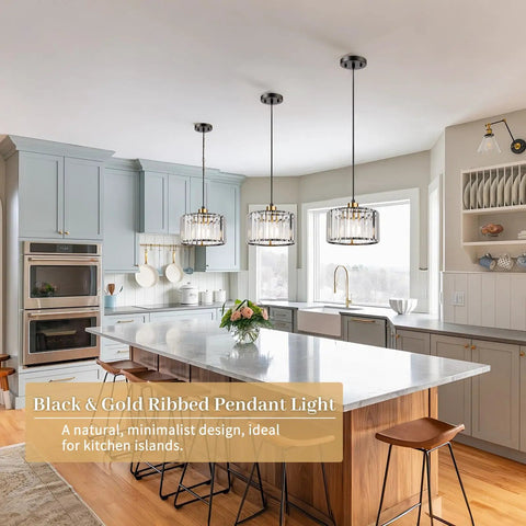 Total Glow Up Modern Crystal Pendant Lights For Kitchen Island In Sleek Black And Gold Height Adjustable Hanging Chandelier For Dining Room Decor with three pendants over a kitchen island.