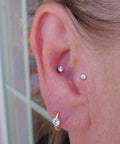 Threadless Piercing Tapers Set Go To For Changing And Insertion Tools 16G 18G 20G Titanium Threadless Insertion Pins in use on ear