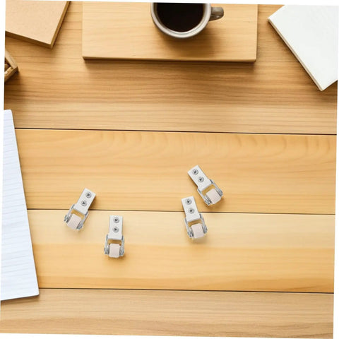 Six Pack Nylon Guide Wheels In Clean White For Furniture Track Systems And Drawer Hardware on a wooden table with coffee items.