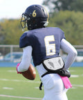Football player wearing high impact football back plate for shoulder pads universal youth and adult protection on the field.