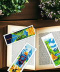 Camping Theme DIY Cross Stitch Bookmark Kit For Beginners, 6 Pack with Mountain View Motifs and Scenic Tourist Prints on open book
