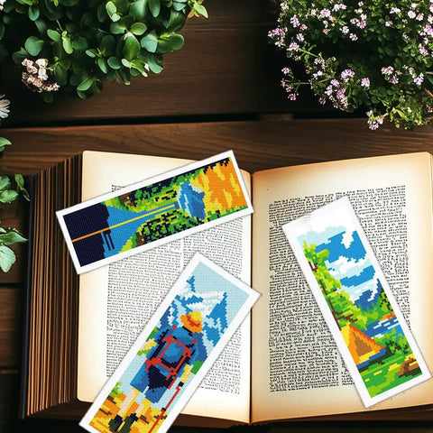 Camping Theme DIY Cross Stitch Bookmark Kit For Beginners, 6 Pack with Mountain View Motifs and Scenic Tourist Prints on open book