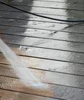 One Gallon Ready To Roll Deck Stain Stripper Cuts Straight Through Weathered Oil And Water Coats For Dead Simple Prep And A Fresh Real Deal Wood Finish On Decks being applied to wooden deck.