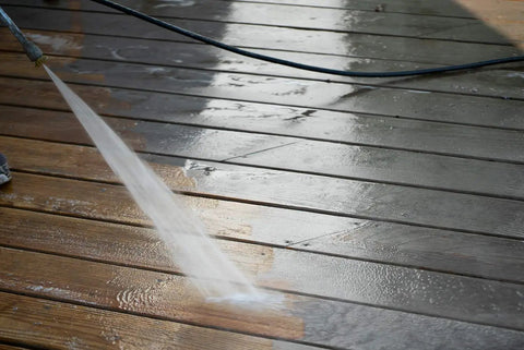 One Gallon Ready To Roll Deck Stain Stripper Cuts Straight Through Weathered Oil And Water Coats For Dead Simple Prep And A Fresh Real Deal Wood Finish On Decks being applied to wooden deck.