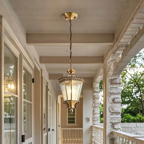 Copper Outdoor Pendant Light With Waterproof Anti Rust Finish installed on a porch ceiling, brass exterior hanging fixture