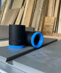 One Seven Eight Inch Hose Adapter For Two And One Quarter Inch Table Saw Dust Ports With Quick Twist Lock on workbench