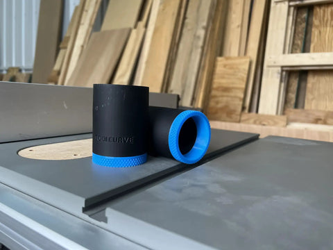 One Seven Eight Inch Hose Adapter For Two And One Quarter Inch Table Saw Dust Ports With Quick Twist Lock on workbench