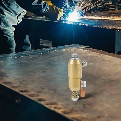 Stomp Out Wire Wrangling With This 360 Degree Rotatable Welding Ground Clamp Made From Solid Brass For Smooth Current Flow And Zero Hassle While Boosting Your Efficiency On The Job Site Today. Solid brass clamp on a metal work surface.