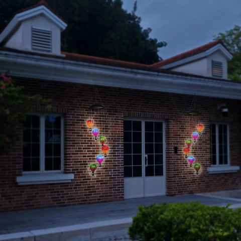Solar Hot Air Balloon Lantern And Wind Chimes For Garden Outdoor Hanging Lights on brick house with color changing LED glow