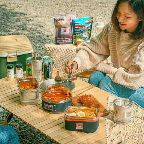 Flameless Self Heating Lunch Box Portable Food Warmer Oven 1200ml 40oz at outdoor camping scene with meals and woman.