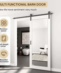 36x80 Inch Mirror Barn Door With Sliding Hardware Kit Included Full Length One Lite Mirror Door White Finish Solid Wood Core With Waterproof PVC Surface Scratch Resistant No Assembly Required installed in modern room.