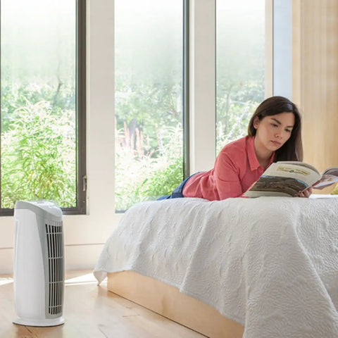 Replacement Air Filter For T500 Tower Air Purifier with True HEPA Filter in a bedroom setting with woman reading book