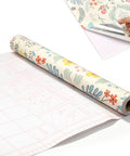 Self Adhesive Floral Peel And Stick Wallpaper Roll For Renters Featuring No Fuss Quick Install Water Resistant Scratch Proof Vinyl Wall Covering that shows a roll of floral wallpaper.