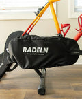 Indoor Bike Trainer Chain Cover And Drivetrain Guard Padded Chainstay Shield with logo on a bike, universal fit, black.