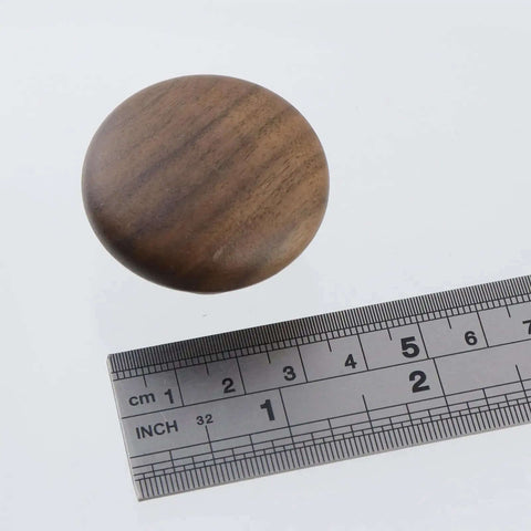 Solid Walnut Wood Cabinet Knob Set 12 Pack Round Mushroom Drawer Pulls With Smooth Wax Finish shown with ruler for size reference.