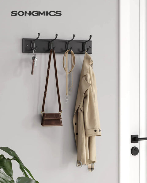 Black Finish Wall Mounted Coat Rack With Dual Metal Hooks Holds Coats Bags Keys In Entryway Bedroom Or Living Room 6.6 Lb Per Hook Load Capacity Keeps Your Hallway Tidy And Ready For Grab And Go. Visible are a coat, purse, and keys hanging.