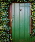 Green wooden door with ivy, showcasing robust installation ideal for Heavy Duty Black Iron Strap Door Hinges 4 Pack With Eight Pre Positioned Screw Holes Built To Last And Tough As Nails And Easy Install For Shed Doors Gates Outdoor Use Rugged Dismantle Design Perfect For Hotels And Clubs.