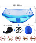 Ultra Comfy Camping Hammock With Mosquito Net, 13ft Tree Straps And Carabiners, blue nylon material, setup accessories shown