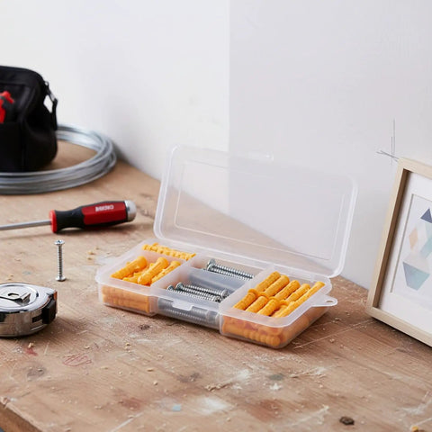 All Purpose Wall Anchors And Screws Kit With Yellow Plastic Plugs And Stainless Steel Screws For Hollow And Solid Walls Assorted Sizes In Heavy Duty Storage Box on a wooden workbench