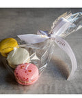 Heckin Great Cellophane Treat Bags 7 X 14 Inches With Gold Twist Ties 100 Pack Sturdy Opp Material Perfect For Cookies Candy Snacks Chocolate Marshmallow Wrapping with colorful macarons.