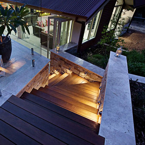 Illuminated stairs with Low Voltage IP65 Waterproof Half Moon LED Step Lights for decks and pathways, enhancing yard ambience.