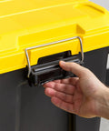 Close-up of Top Shelf 21 Gallon Storage Totes 4 Pack Heavy Duty Lockable Bins With Airtight Weatherproof Gasket Seal Keeps Your Loot Safe And Sound Black Yellow Made In Usa handle