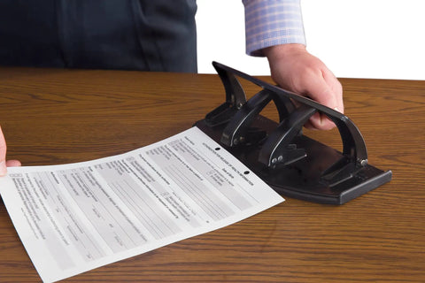20-Sheet Duo Two-Sided Heavy-Duty Hole Punch That Switches Between Two and Three Holes Like a Boss Instantly, on desk in use