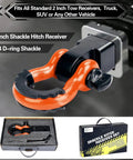 Beefy Heavy Duty Two Inch Shackle Hitch Receiver With Forty Five Thousand Pound Break Strength For Vehicle Recovery Off Road Includes Five Eighth Inch Screw Pin And Three Quarter Inch D Ring Shackles In Bright Orange And Black attached to a truck.