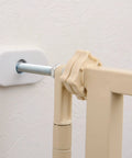 Tough As Nails Extra Tall Cat Gate Heavy Duty Steel Barrier With Foolproof Paw Lock secure mounting detail in beige close-up.