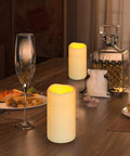 Waterproof Flameless LED Pillar Candles With Remote Timer Battery Operated Pack Of 3 Large Pillars on dining table at night