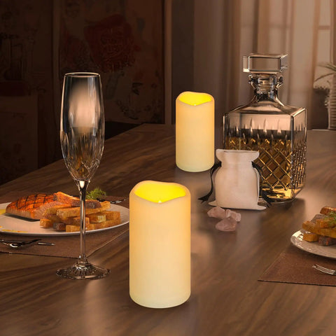 Waterproof Flameless LED Pillar Candles With Remote Timer Battery Operated Pack Of 3 Large Pillars on dining table at night