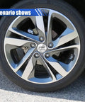 Four Pack Dope American Flag Wheel Center Caps 56Mm on a sporty silver alloy wheel showcasing sleek design and premium protection.