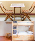 Wooden folding chairs and small table in cozy space with bunk beds and stool, showcasing minimalist design.
