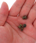 50 Piece Vintage Zinc Alloy Drawer Knobs Straight Up Durable Mini Cabinet Hardware Pulls For Boxes And Dressers Smooth Antique Bronze Finish Hassle Free Install, showing screws and knobs in hand.