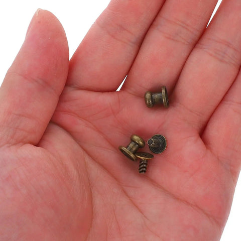 50 Piece Vintage Zinc Alloy Drawer Knobs Straight Up Durable Mini Cabinet Hardware Pulls For Boxes And Dressers Smooth Antique Bronze Finish Hassle Free Install, showing screws and knobs in hand.