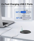 Top Shelf Three Inch Flush Mount Desktop Power Grommet With Two AC Outlets And Four USB Ports Featuring PD 20W Fast Charge Plus A Six Foot Cord connected to a laptop on a desk.