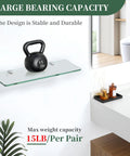 Premium Zinc Alloy Glass Shelf Brackets And Wall Mount Clamps An 8 Piece Heavy Duty Set Built Like A Tank To Securely Cradle Five To Eight Millimeter Glass Panels For Home Decor with a 15lb kettlebell on a glass shelf.