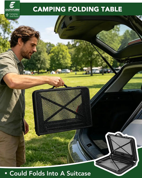 Man holding 2 Foot Folding Table With Carry Handle For Camping And Outdoor Grill Table, Adjustable Black Metal Mesh Surface.